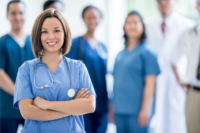 A nurse stands in front of her peers